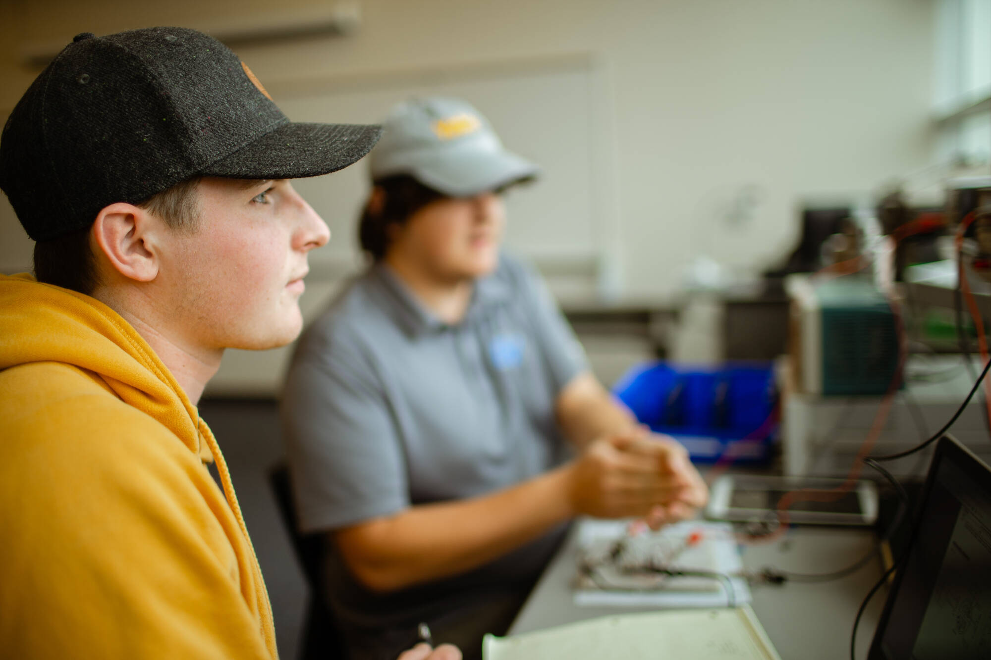 Two Computer Science Students looking on the computer screen in a computer lab